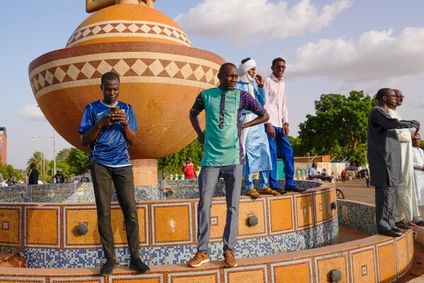 Supporters of Nigerien President Mohamed Bazoum gather in his support in Niamey, Niger, Wednesday July 26 2023. Governing bodies in Africa condemned what they characterized as a coup attempt Wednesday against Niger's president, whose official Twitter account reported that elements of the presidential guard engaged in an 