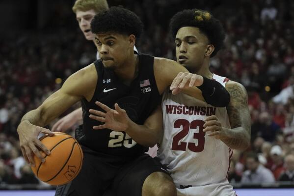 Michigan State's Malik Hall tries to get past Wisconsin's Chucky Hepburn during the first half of an NCAA college basketball game Tuesday, Jan. 10, 2023, in Madison, Wis. (AP Photo/Morry Gash)