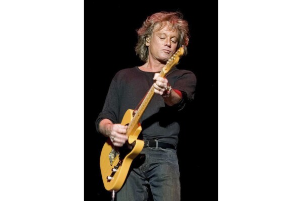 This image released by Raspberries LLC shows Eric Carmen performing in Cleveland on Dec. 14, 2007. Carmen, who fronted the power-pop 1970s band the Raspberries and later had soaring pop hits like “All by Myself” and “Hungry Eyes” from the hit “Dirty Dancing” soundtrack, has died. His death was announced on his website by his wife, Amy Carmen, who did not reveal a cause, saying only that he died “in his sleep, over the weekend.” He was 74. (Gene Taylor/Raspberries LLC via AP)