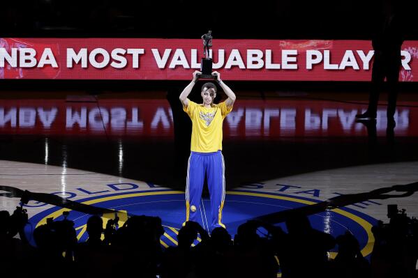 FILE - Golden State Warriors guard Stephen Curry acknowledges the crowd during a ceremony for winning the NBA's Most Valuable Player award before Game 2 in a second-round NBA playoff basketball series between the Warriors and the Memphis Grizzlies, May 5, 2015, in Oakland, Calif. (AP Photo/Jeff Chiu, File)