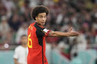 FILE - Belgium's Axel Witsel gestures during the World Cup group F soccer match between Belgium and Morocco, at the Al Thumama Stadium in Doha, Qatar, on Nov. 27, 2022. Veteran midfielder Axel Witsel is the latest member of Belgium's so-called Golden Generation to end his international career. The 34-year-old Witsel has made 130 appearances in his 15-year career with Belgium, scoring 12 goals with the Red Devils. He said on Friday, May 12, 2023 he was proud to represent Belgium but now wants to dedicate more time to his family and focus on his career with Spanish club Atletico Madrid. (AP Photo/Frank Augstein, File)