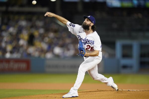 Los Angeles Dodgers starting pitcher Tony Gonsolin (26) throws during the first inning of a baseball game against the Colorado Rockies in Los Angeles, Monday, Oct. 3, 2022. (AP Photo/Ashley Landis)
