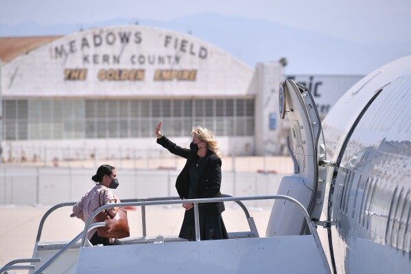 First lady Jill Biden waves as she boards a plane before departing from Meadows Field Airport in Bakersfield, Calif., April 1, 2021. (Mandel Ngan/Pool via AP, File)