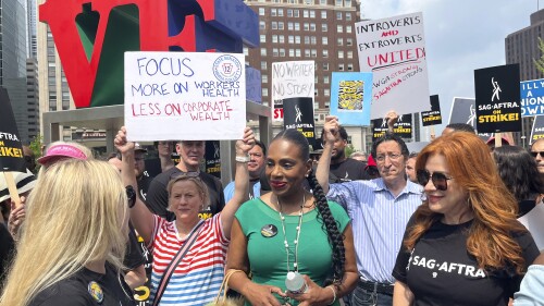 Actors Sheryl Lee Ralph, left, and Lisa Ann Walter, members of the cast of "Abbott Elementary," participate in a rally in support of the actors and writers strikes at Love Park in Philadelphia on Thursday, July 20, 2023. The actors strike comes more than two months after screenwriters began striking in their bid to get better pay and working conditions. (AP Photo/Tassanee Vejpongsa)
