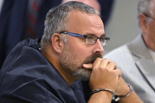 CORRECTS TO HEARING, INSTEAD OF ARRAIGNMENT - Former Letcher County Ky. Sheriff Shawn "Mickey" Stines, accused of killing District Judge Kevin Mullins, listens to testimony during a hearing at the Morgan County Courthouse in West Liberty, Ky., Tuesday, Oct. 1, 2024. (AP Photo/Timothy D. Easley)