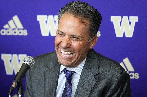 New Washington head coach Jedd Fisch laughs during an NCAA college football press conference to introduce him to the community, Tuesday, Jan. 16, 2024, in Seattle. (APPhoto/Lindsey Wasson)
