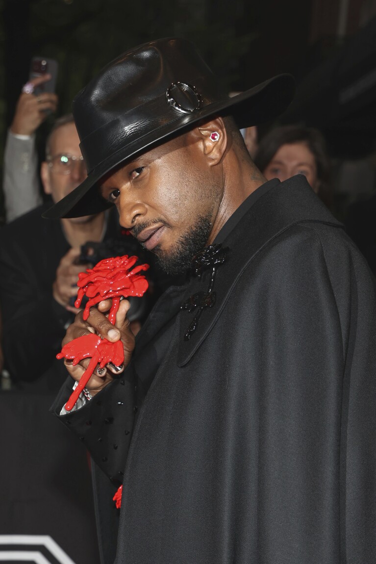 Usher departs The Mark Hotel prior to attending The Metropolitan Museum of Art's Costume Institute benefit gala celebrating the opening of "Sleeping Beauties: Reawakening Fashion" on Monday, May 6, 2024, in New York. (Photo by CJ Rivera/Invision/AP)