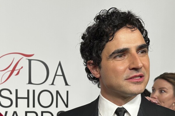 FILE - Fashion designer Zac Posen speaks with the media on the red carpet arrival at the Council of Fashion Designers of America awards, Monday, Nov. 6, 2023, in New York. In news announced Monday, Feb. 5, 2024, Gap has tapped Posen as the chain's creative director. (AP Photo/Ted Shaffrey, File)