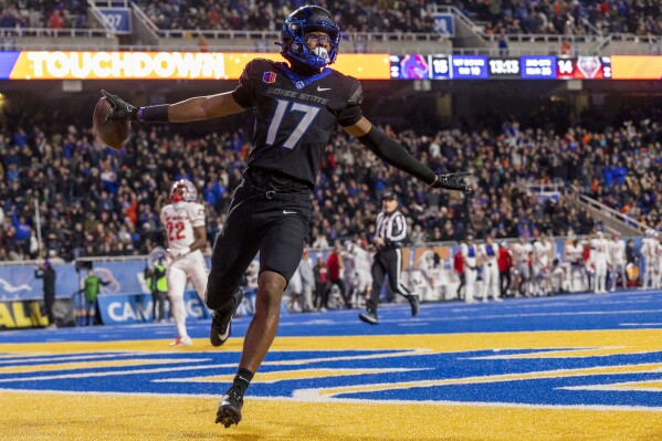 Boise State wide receiver Prince Strachan celebrates his touchdown reception against New Mexico during the second quarter of an NCAA college football game Saturday, Nov. 11, 2023, in Boise, Idaho. (Darin Oswald//Idaho Statesman via AP)