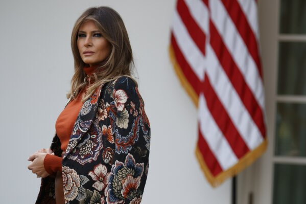 
              FILE - In this Nov. 21, 2017, file photo, first lady Melania Trump listens as President Donald Trump speaks during the National Thanksgiving Turkey Pardoning Ceremony in the Rose Garden of the White House in Washington. There’s a long tradition of presidents defending their first ladies, and it’s now Trump’s turn. Trump pushed back recently after Vanity Fair magazine, citing an anonymous source, reported that Melania Trump didn’t want to become first lady “come hell or high water” and didn’t think it would happen. (AP Photo/Evan Vucci, File)
            
