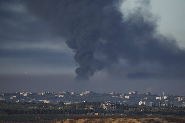 Smoke rises following an Israeli bombardment in the Gaza Strip, as seen from southern Israel, Friday, Dec. 15, 2023. (AP Photo/Leo Correa)