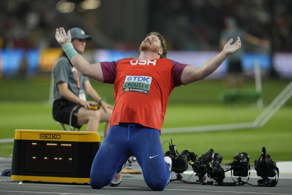 FILE - Ryan Crouser, of the United States, reacts after his final throw in the men's shot put final as he wins gold during the World Athletics Championships in Budapest, Hungary, Saturday, Aug. 19, 2023. Everything is trending in the right direction for the shot put world champion after being diagnosed with two blood clots in his left leg just before his win at the world championships last month. (AP Photo/Ashley Landis, File)