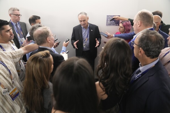 Major League Baseball Commissioner Rob Manfred talks with reporters before Game 1 of the baseball World Series between the Arizona Diamondbacks and the Texas Rangers Friday, Oct. 27, 2023, in Arlington, Texas. (AP Photo/Brynn Anderson)