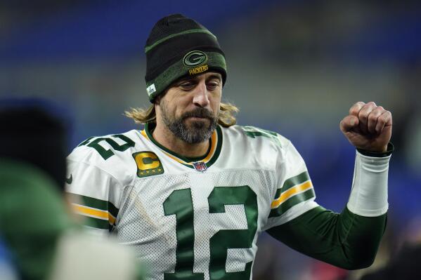 Green Bay Packers quarterback Aaron Rodgers walks off the field after an NFL football game against the Baltimore Ravens, Sunday, Dec. 19, 2021, in Baltimore. Green Bay won 31-30. (AP Photo/Julio Cortez)