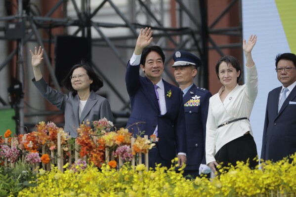 New Taiwan's President Lai Ching-te, center, Vice President Hsiao Bi-khim, right, and former President Tsai Ing-wen wave during Lai's inauguration ceremonies in Taipei, Taiwan, Monday, May 20, 2024. Taiwan inaugurated Lai as its new president Monday, installing a relative moderate who will continue the self-governing island democracy’s policy of de facto independence while seeking to bolster its defenses against China.(AP Photo/Chiang Ying-ying)