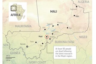 Unknown assailants killed at least 95 people in an ethnic Dogon village overnight.;