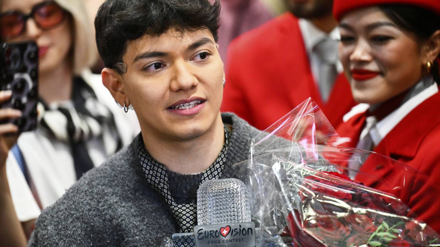 Austria welcomes JJ back home with cheers, hugs and roses after winning Eurovision Song Contest