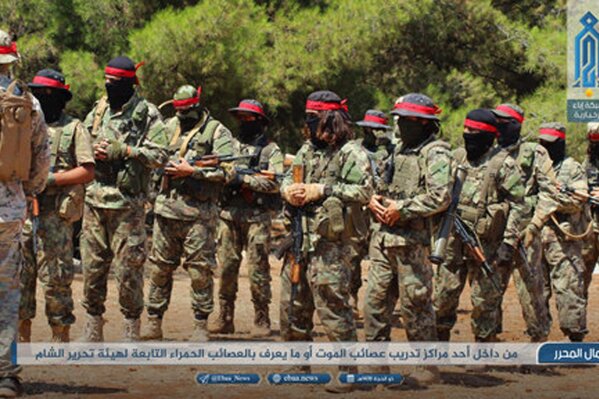 
              FILE - This Aug 20, 2018 photo, provided by the al-Qaida-affiliated Ibaa News Network, shows fighters of the al-Qaida-linked coalition known as Hay'at Tahrir al-Sham, training in Idlib province, Syria. After eight months of relative calm, Idlib is once again a theater for bloody military operations as Syrian government troops, backed by Russia, push their way into the rebel-held enclave in a widening offensive. The violence in May 2019 threatens to completely unravel a crumbling cease-fire agreement reached between Turkey and Russia last September. (Ibaa News Network, via AP, File)
            