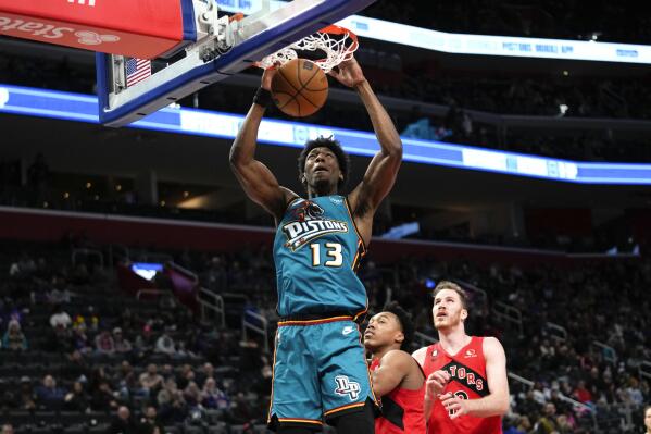 Detroit Pistons' James Wiseman (13) dunks against the Toronto Raptors in the second half of an NBA basketball game in Detroit, Saturday, Feb. 25, 2023. (AP Photo/Paul Sancya)