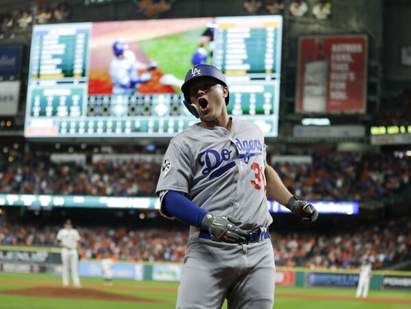 The Latest: Dodgers take Game 4 with big 9th inning