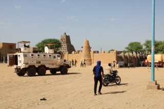 FILE - United Nations forces patrol the streets of Timbuktu, Mali, on Sept. 26, 2021. The United Nations is in the throes of what Secretary-General António Guterres calls an “unprecedented” six-month exit from Mali on orders of the West African nation’s military junta, which has brought in mercenaries from Russia’s Wagner Group to help fight an Islamic insurgency. (AP Photo/Moulaye Sayah, File)