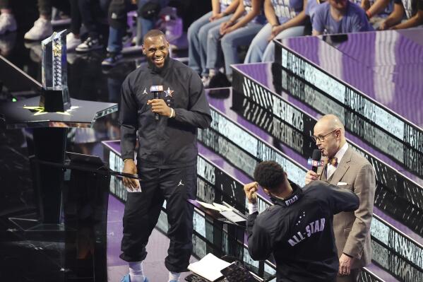 LeBron James and forward Giannis Antetokounmpo laugh as they pick teams before the NBA basketball All-Star game Sunday, Feb. 19, 2023, in Salt Lake City. (AP Photo/Rob Gray)