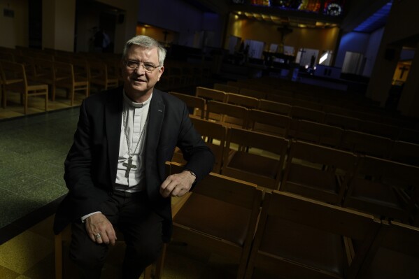 FILE - Bishop of Antwerp, Johan Bonny, poses for a portrait at a church in Lier, Belgium, on May 24, 2023. Bonny, a prominent Belgian bishop on Wednesday, Sept. 27, 2023, criticized the Vatican for failing to defrock a former bishop who admitted sexually abusing children, saying it had led to massive frustration with the highest Roman Catholic authorities. Disgraced bishop Roger Vangheluwe, who was brought down by a sexual abuse scandal 13 years ago, became a symbol in Belgium of the Roman Catholic church's hypocrisy in dealing with abuse in its own ranks. (AP Photo/Virginia Mayo)
