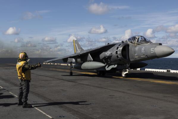Final checker gives a thumb up to a AV-8B Harrier taking off from the flight deck of the Wasp-class amphibious assault ship USS Kearsarge (LHD 3), operating in the Baltic Sea, Saturday, Sept. 3, 2022. Amid Russia's war on Ukraine and tensions in the Baltic Sea region, USS Kearsarge is the first U.S. Navy amphibious assault ship in at least 20 years to be taking part in international training in the Baltic. (AP Photo/Michal Dyjuk)