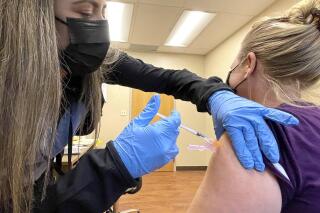 nurse Jennifer Ulloa administers a COVID-19 vaccine Tuesday, July 27, 2021, at the County's vaccination clinic in Whispering Pines, Calif. (Elias Funez/The Union via AP)