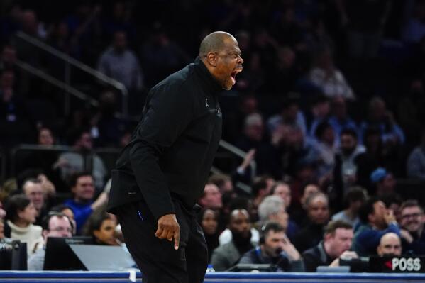 Georgetown coach Patrick Ewing calls out to the team after a shot clock violation during the first half of an NCAA college basketball game against Seton Hall at the Big East men's tournament Wednesday, March 9, 2022, in New York. Seton Hall won 57-53. (AP Photo/Frank Franklin II)