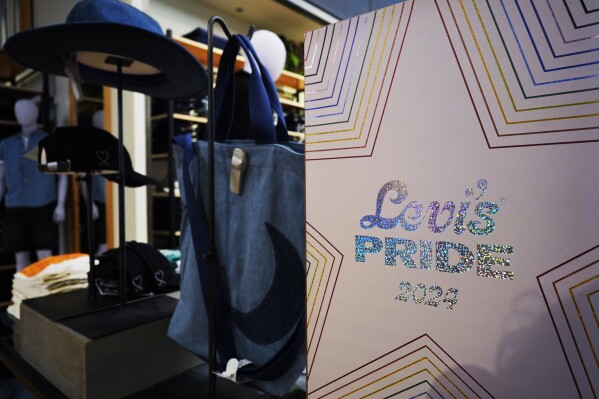 A Levi's Pride 2024 sign is shown at Levi's Store in downtown Chicago, Monday, June 10, 2024. Analysts and advocates say the marketing for Pride month is toned down compared to previous years, and at some chains, there's no trace of Pride at all. (AP Photo/Nam Y. Huh)