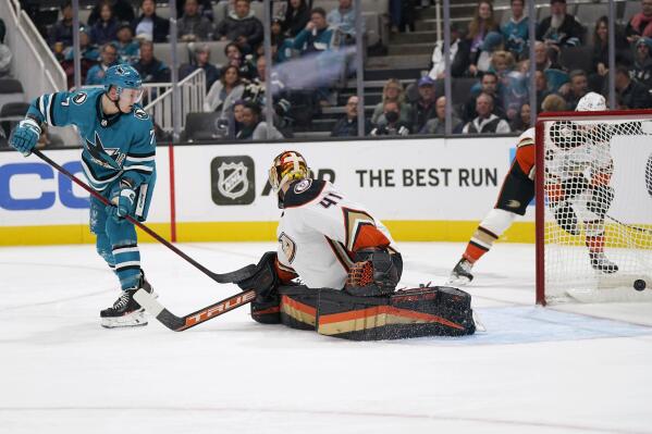 UPDATES TO REFLECT CHANGE IN SCORING ON THE GOAL - San Jose Sharks center Nico Sturm, left, watches a goal by Erik Karlsson against Anaheim Ducks goaltender Anthony Stolarz (41) during the first period of an NHL hockey game in San Jose, Calif., Tuesday, Nov. 1, 2022. (AP Photo/Jeff Chiu)