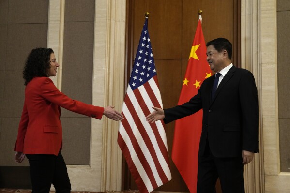U.S. Deputy Assistant to the President and Deputy Homeland Security Advisor Jen Daskal, left, shakes hands with Chinese Minister of Public Security Wang Xiaohong before a meeting at the Diaoyutai State Guesthouse in Beijing, Tuesday, Jan. 30, 2024. Daskal is leading an interagency U.S. delegation to Beijing to launch the U.S.-China Counternarcotics Working Group. (AP Photo/Ng Han Guan, Pool)