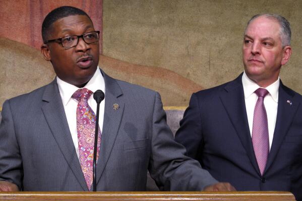 FILE - Transportation and Development Secretary Shawn Wilson, left, speaks about proposed surplus spending on roadwork as Louisiana Gov. John Bel Edwards listens, March 28, 2018, in Baton Rouge, La. Wilson, who retired from his state DOTD position last week, announced Monday, March 6, 2023, that he is running for Louisiana governor in October as a Democrat. (AP Photo/Melinda Deslatte, File)