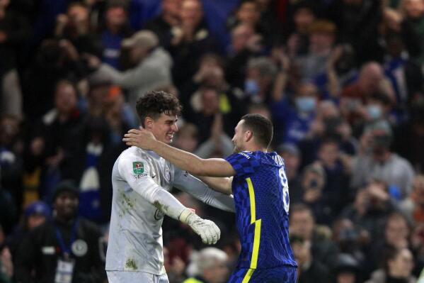 Chelsea's goalkeeper Kepa Arrizabalaga, left, celebrates with Chelsea's Mateo Kovacic after the penalty shootout during the English League Cup fourth round soccer match between Chelsea and Southampton, at Stamford Bridge Stadium in London, Tuesday, Oct. 26, 2021. (AP Photo/Ian Walton)