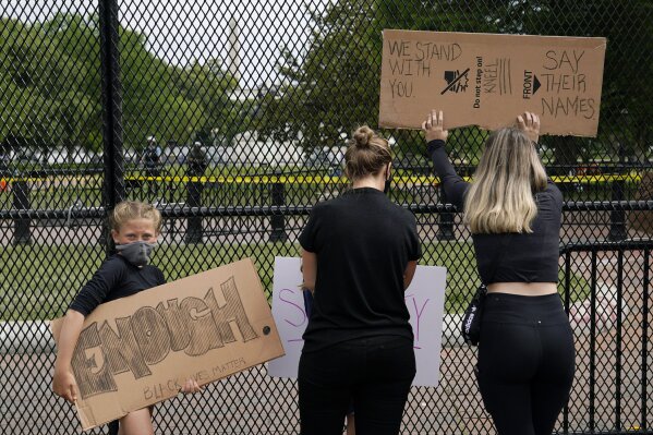 FILE - In this June 2, 2020, file photo, demonstrators gather to protest the death of George Floyd, near the White House in Washington. As a new generation steps up, activists and historians believ...