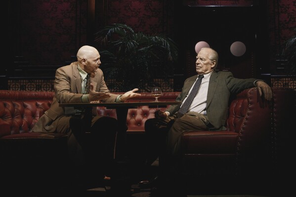This image released by Polk & Co. shows Bill Burr, left, and Michael McKean during a performance of "Glengarry Glen Ross," in New York. (Emilio Madrid/Polk & Co. via AP)