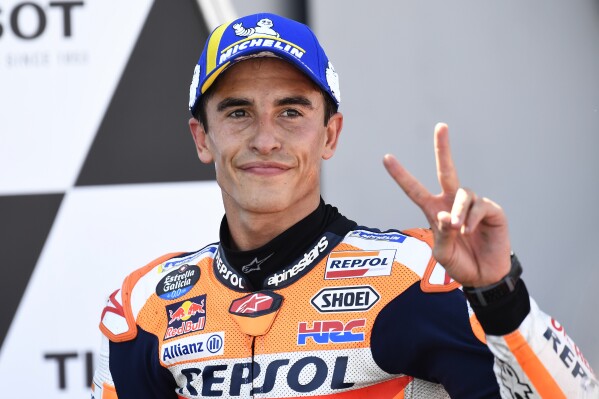 FILE - Marc Marquez of Spain reacts on the podium after taking second place in the Alcaniz Aragon Moto GP race at the MotorLand Aragon circuit, in Alcaniz, Spain Sunday, Sept. 12, 2021. Honda’s MotoGP team says that former world champion Marc Márquez will be leaving the team at the end of the season. That will conclude a highly successful 11-year-stint during which the Spaniards won six MotoGP championships. (AP Photo/Jose Breton, File)