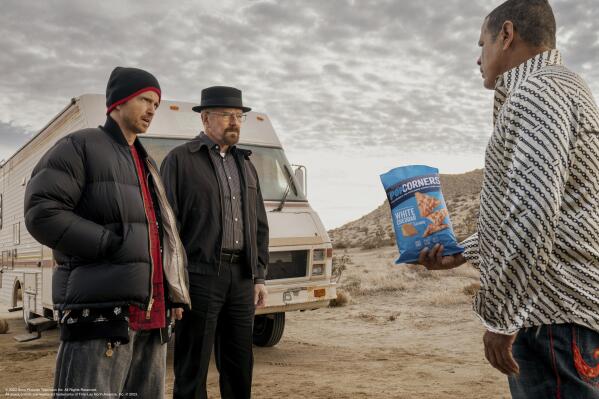 This photo provided by Frito-Lay shows Aaron Paul, Bryan Cranston and Raymond Cruz in scene from PopCorners 2023 Super Bowl NFL football spot. (Frito-Lay via AP)