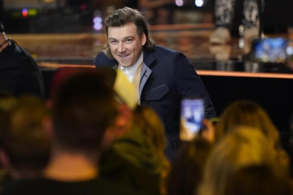 Morgan Wallen accepts the award for album of the year for "Dangerous: The Double Album" at the 57th Academy of Country Music Awards on Monday, March 7, 2022, at Allegiant Stadium in Las Vegas. (AP Photo/John Locher)