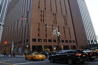 
              In this Dec. 4, 2017, photo, 4 New York Plaza, where American Media Inc., has its headquarters in New York City. An Associated Press investigation reveals that the top editor at National Enquirer publisher American Media Inc., Dylan Howard, who previously faced allegations of sexual misconduct at the gossip news giant, was also accused of harassing behavior at another employer. He resigned from the startup celebrity news site Celebuzz in 2013 amid a human resources investigation, after he had already left American Media’s Los Angeles office in 2012 amid allegations of sexual harassment. (AP Photo/Kathy Willens)
            