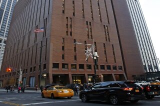 In this Dec. 4, 2017, photo, 4 New York Plaza, where American Media Inc., has its headquarters in New York City. An Associated Press investigation reveals that the top editor at National Enquirer publisher American Media Inc., Dylan Howard, who previously faced allegations of sexual misconduct at the gossip news giant, was also accused of harassing behavior at another employer. He resigned from the startup celebrity news site Celebuzz in 2013 amid a human resources investigation, after he had already left American Media’s Los Angeles office in 2012 amid allegations of sexual harassment. (AP Photo/Kathy Willens)