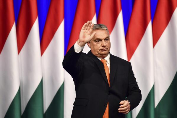 FILE - Viktor Orban waves after his annual state of the nation speech in Varkert Bazaar conference hall of Budapest, Hungary, Feb. 12, 2022. Russia’s invasion of Ukraine has shocked the former Soviet satellite states of Central and Eastern Europe, drawing strong condemnation even from the region’s most pro-Kremlin politicians. On Thursday Feb. 24, 2022, Orban was clear in his condemnation of the Kremlin. “Russia attacked Ukraine this morning with military force,” Orban said in a video on Facebook. “Together with our European Union and NATO allies, we condemn Russia’s military action.” (AP Photo/Anna Szilagyi, File)