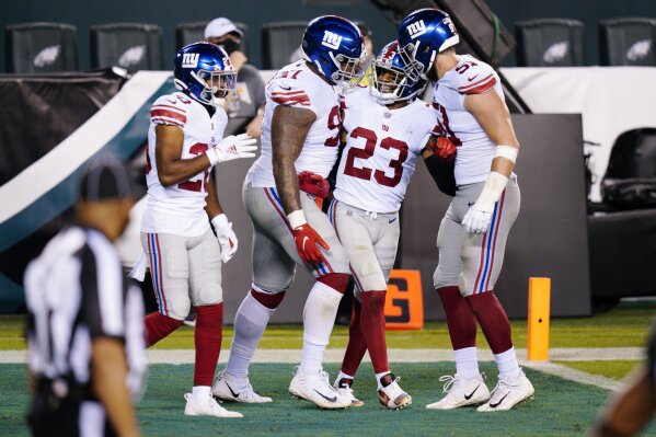 New York Giants' Logan Ryan (23) celebrates with teammates after the Giants forced a turnover on downs during the second half of an NFL football game against the Philadelphia Eagles, Thursday, Oct. 22, 2020, in Philadelphia. (AP Photo/Chris Szagola)