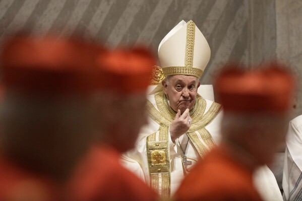 Pope Francis presides over the First Vespers and Te Deum, the rite of thanksgiving for the end of the year, in Saint Peter's Basilica at the Vatican, Sunday, Dec. 31, 2023. (AP Photo/Andrew Medichini)