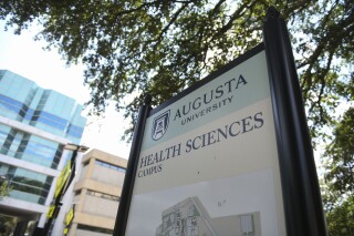 FILE - An Augusta University campus map sits off Laney Walker Boulevard on June 27,j 2023. An Atlanta-area hospital system has completed its takeover of Augusta University's hospitals, with the University System of Georgia and Wellstar Health system saying the deal promises greater financial stability, more medical training and better care.(Katie Goodale/The Augusta Chronicle via AP, File)