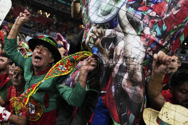 Portugal's fans celebrate after the Nations League final soccer match between Portugal and Spain at the Allianz Arena in Munich, Germany, Monday, June 9, 2025. (AP Photo/Matthias Schrader)