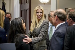 
              In this Nov. 14, 2018, photo, Ivanka Trump, the daughter of President Donald Trump, center, greets guests after President Donald Trump spoke about prison reform in the Roosevelt Room of the White House in Washington. Ivanka Trump, the president’s daughter and adviser, sent hundreds of emails about government business from a personal email account last year. That’s according to the Washington Post, which reports the emails were sent to other White House aides, Cabinet officials and her assistants. (AP Photo/Andrew Harnik)
            