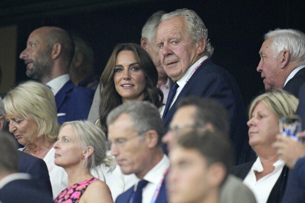 Kate, Princess of Wales stands with Bill Beaumont, the chairman of World Rugby ahead of the Rugby World Cup Pool D match between England and Argentina in the Stade de Marseille, Marseille, France Saturday, Sept. 9, 2023. (AP Photo/Daniel Cole)