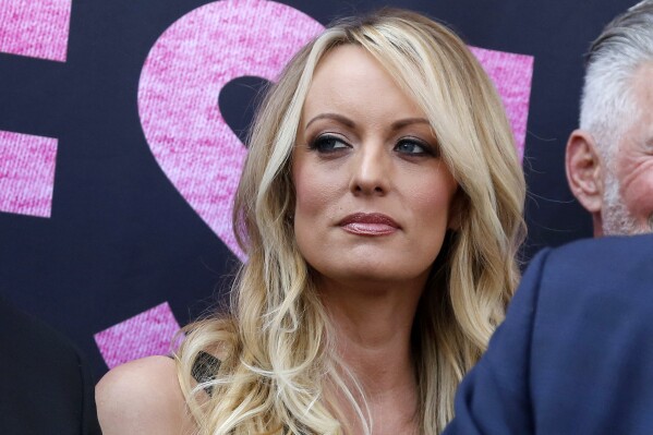 FILE - Stormy Daniels appears at an event, May 23, 2018, in West Hollywood, Calif. The hush money trial of former President Donald Trump begins Monday, April 15, 2024, with jury selection. It's the first criminal trial of a former U.S. commander-in-chief. The charges in the trial center on $130,000 in payments that Trump's company made to his then-lawyer, Michael Cohen. He paid that sum on Trump's behalf to keep Daniels from going public, a month before the election, with her claims of a sexual encounter with Trump a decade earlier. (AP Photo/Ringo H.W. Chiu, File)